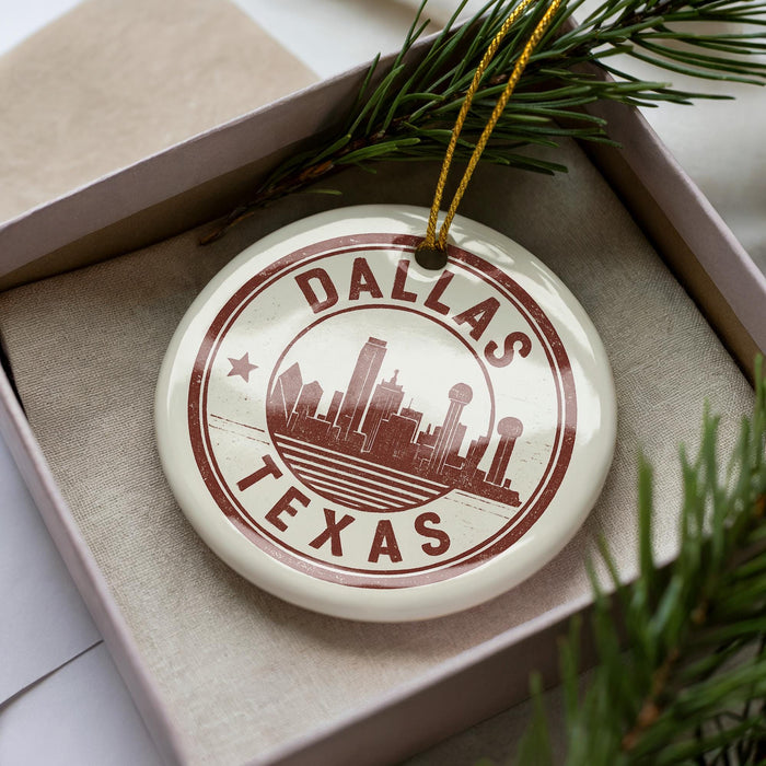 A circular ornament with the text "DALLAS TEXAS" printed on it, surrounded by a border and a star.