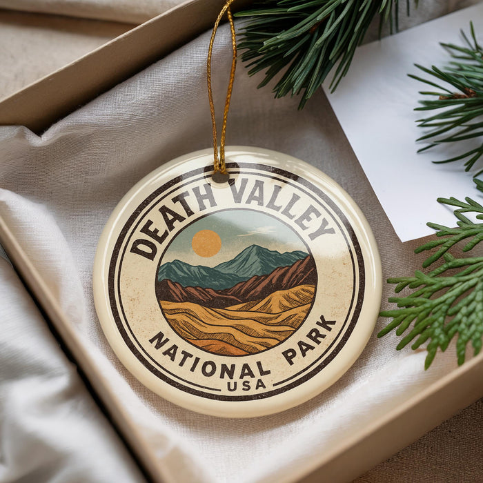 A circular ornament with the text "DEATH VALLEY NATIONAL PARK USA" printed on it, hanging from a string.