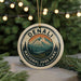 A decorative ornament featuring the name "DENALI" and the text "NATIONAL PARK PARK U.S.A." in a circular design, with a mountain landscape and pine trees in the center.