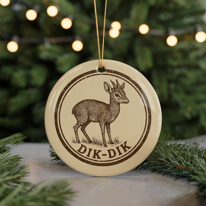 A round ornament featuring a deer with horns, hanging from a string.