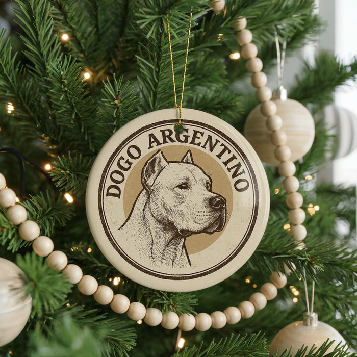 A circular ornament on a Christmas tree featuring a dog's head and the text "DOGO ARGENTINO".