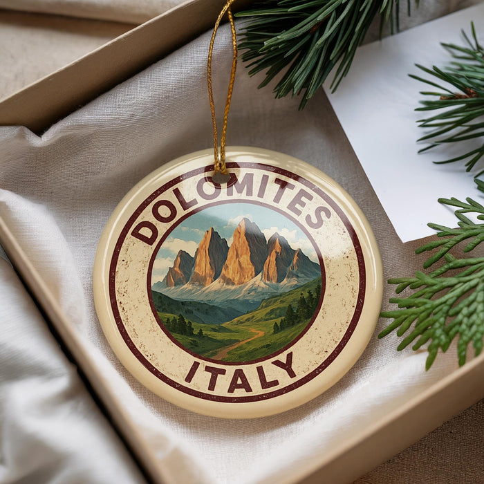 A decorative ornament with a mountain landscape and the text "DOLOMITES ITALY" is displayed in a box with pine branches.