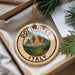 A decorative ornament with a mountain landscape and the text "DOLOMITES ITALY" is displayed in a box with pine branches.