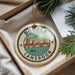 A decorative ornament with the text "DOUALA CAMERON" and an illustration of a cityscape with a bridge and a boat.
