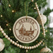A circular ornament on a Christmas tree, featuring the image of Dresden, Germany, with the text "Dresden Germany" prominently displayed.