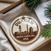 A decorative ornament with the text "DURHAM NORTH CAROLINA USA" printed on it, hanging from a string.