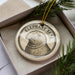 A circular ornament with the text "ELEPHANT SEAL" printed on it, surrounded by a decorative border.