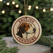 A circular ornament featuring a beagle dog's head, with the text "ENGLISH FOXHOUND" around the edge.