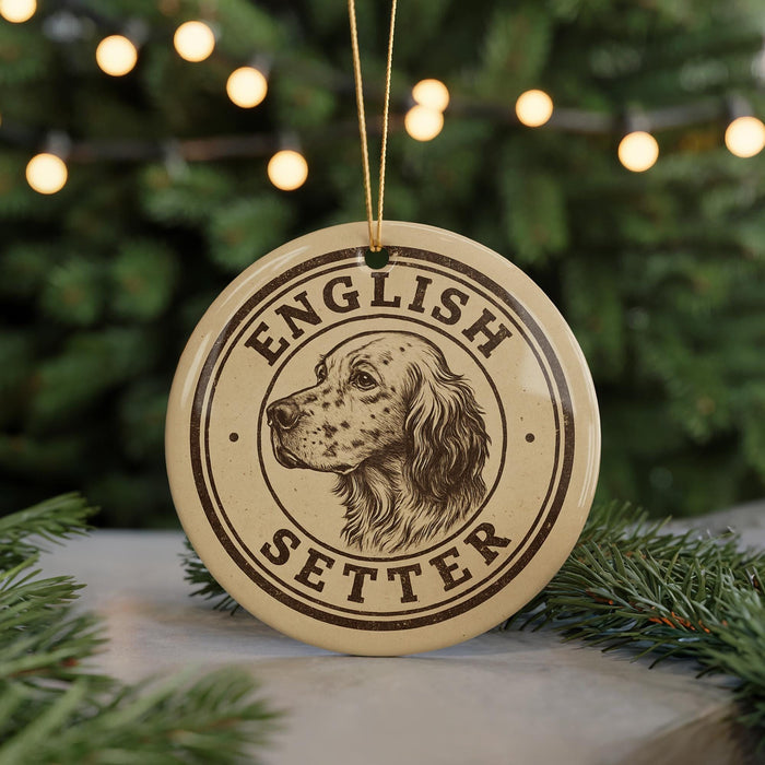 A circular ornament with the text "ENGLISH SETTER" and a depiction of a dog's head is displayed in front of a Christmas tree with twinkling lights.