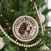 A Christmas tree decorated with ornaments, including a circular ornament with the text "English Springer Spaniel" and a picture of a dog's head.