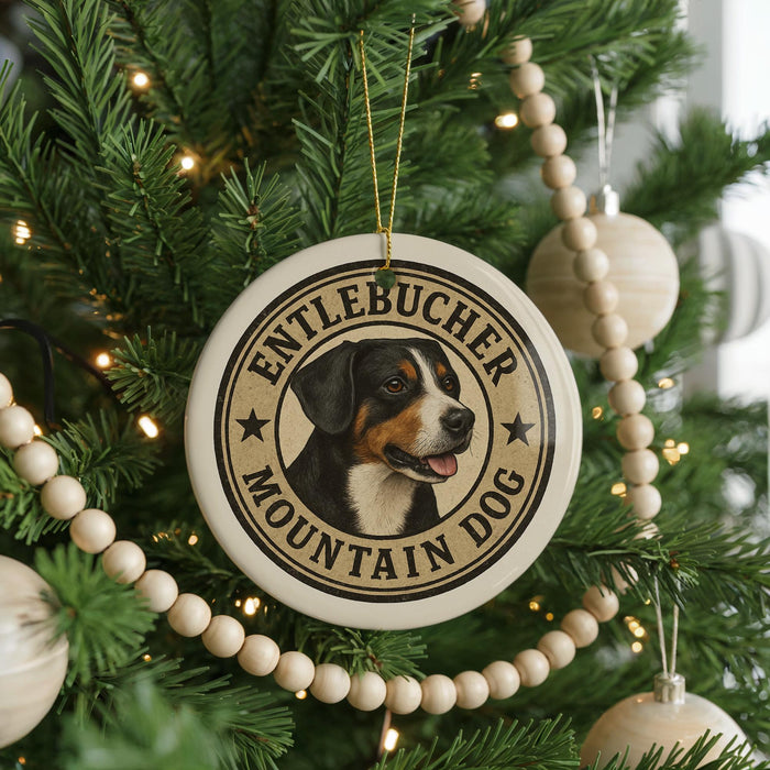 A Christmas tree decorated with ornaments, including a circular ornament with a picture of a dog and the text "Entlebucher Mountain Dog".