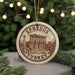 A circular ornament with the text "EPHESUS TURKEY" and an illustration of the ancient city of Ephesus, Turkey, hanging from a string.