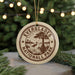 A circular ornament with the text "EVERGLADES NATIONAL PARK" and a graphic of a bird standing on a tree, surrounded by greenery.
