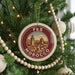 A circular ornament on a Christmas tree, featuring a cityscape and the text "FES MOROCCO" in the center.