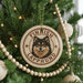 A circular ornament with a picture of a dog's face and the text "FINISH LAPPHUND" is hanging on a Christmas tree.