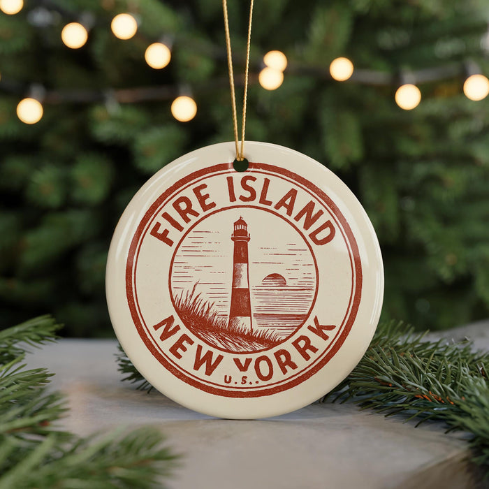 A circular ornament with the text "FIRE ISLAND NEW YORK" and a lighthouse illustration, hanging from a string.