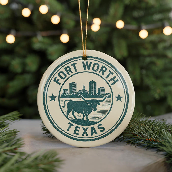 A circular ornament with the text "FORT WORTH TEXAS" and an illustration of a bull, surrounded by lights and greenery.