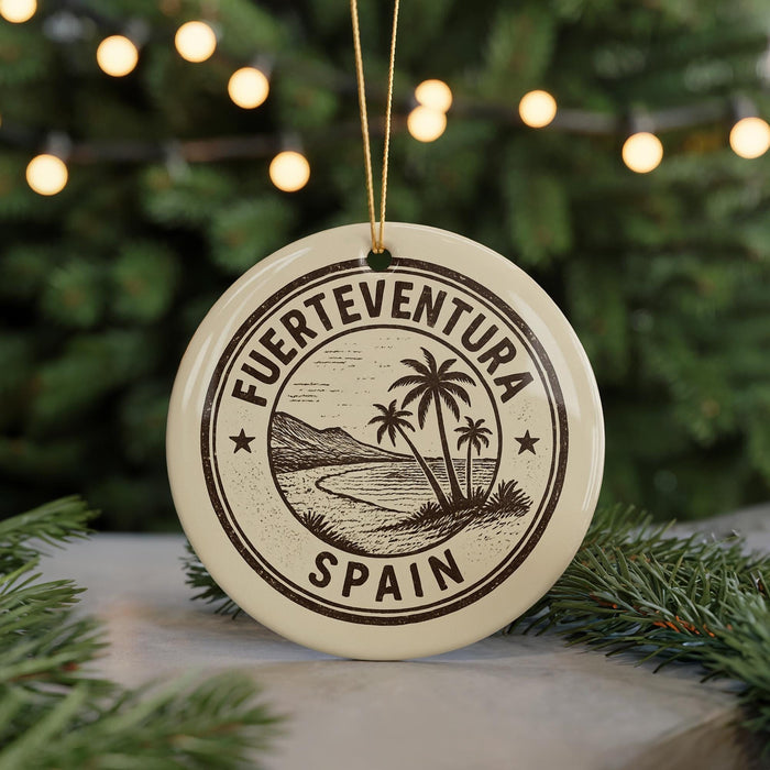 A circular ornament with the text "FUERTEVENTURA SPAIN" printed on it, surrounded by a palm tree illustration.