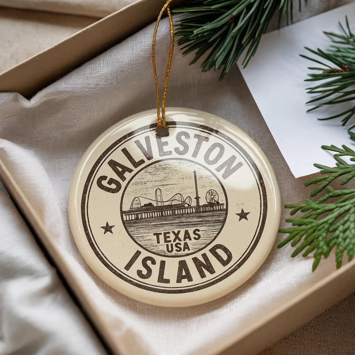 A circular ornament with the text "GALVESTON TEXAS USA ISLAND" printed on it, hanging from a string.