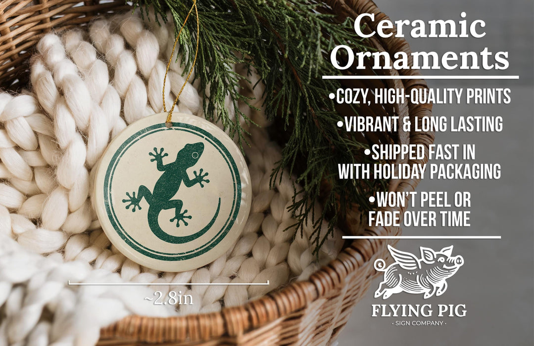 Ceramic ornaments, featuring a ceramic ornament with a green lizard design, are displayed in a woven basket.