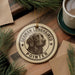 A round ornament featuring a German long haired pointer dog, with the text "German Long Haired Pointer" around the dog's head.