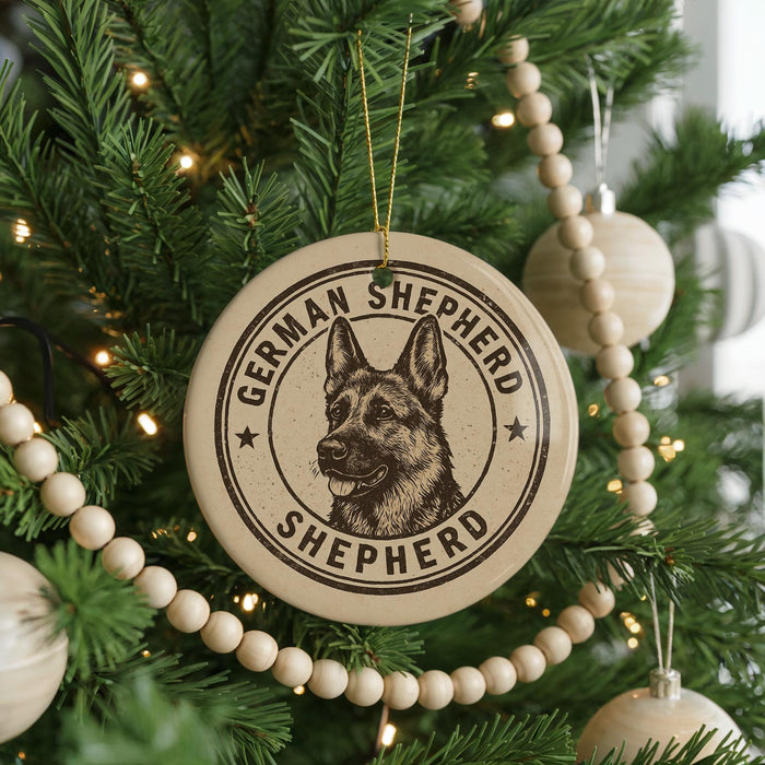 A Christmas tree decorated with ornaments, including a circular ornament with a German Shepherd dog image and the text "German Shepherd" and "Shepherd" printed on it.