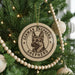 A Christmas tree decorated with ornaments, including a circular ornament with a German Shepherd dog image and the text "German Shepherd" and "Shepherd" printed on it.
