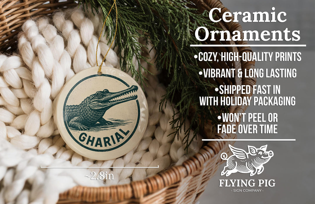 Ceramic ornaments, featuring a ceramic alligator ornament with the text "GHARIAL" on it, hanging from a wicker basket.