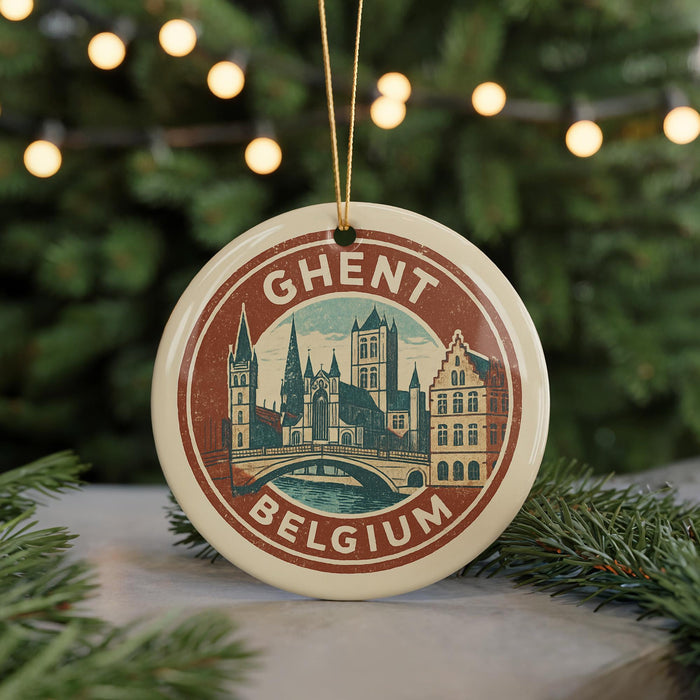 A circular ornament with a picture of a city skyline and the text "Ghent, Belgium" on it, hanging from a string.