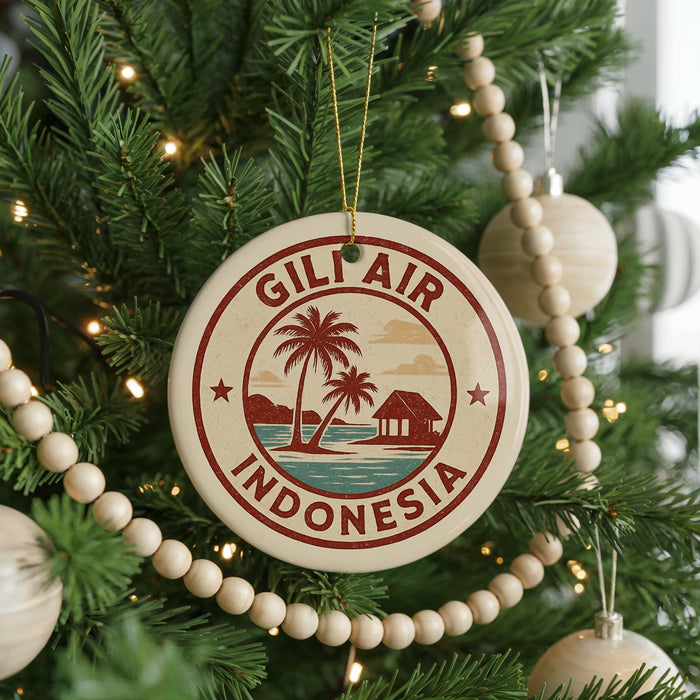 A round ornament on a Christmas tree with the text "GILF AIR INDONESIA" and a palm tree design.