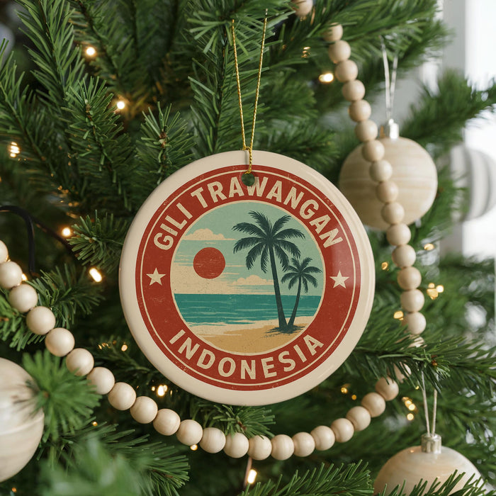 A round ornament on a Christmas tree, featuring a palm tree and the text "GILI TRAWANGAN INDONESIA".