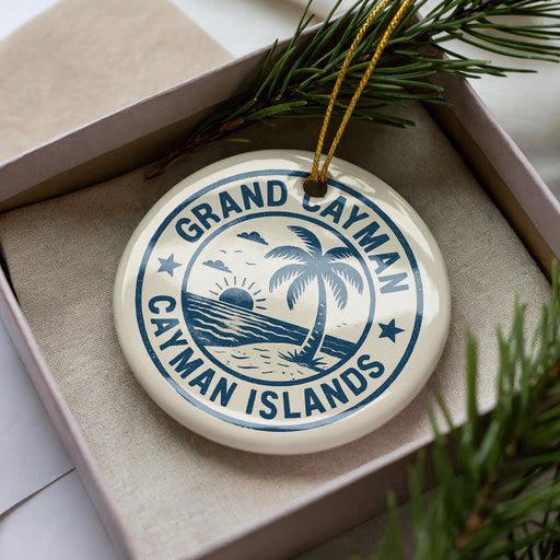 A circular ornament with the text "GRAND CASYMAN ISLANDS" printed on it, surrounded by a palm tree and a beach scene.