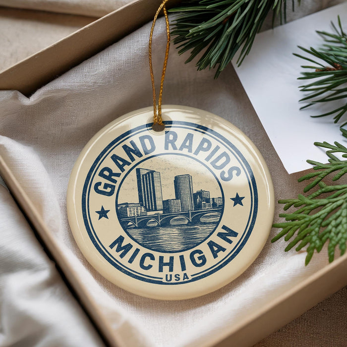 A decorative ornament with the text "GRAND RAPIDS MICHIGAN USA" printed on it, hanging from a string.