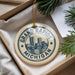 A decorative ornament with the text "GRAND RAPIDS MICHIGAN USA" printed on it, hanging from a string.