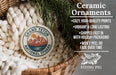 Ceramic ornaments, featuring a design of a mountain landscape with a sun, are displayed in a woven basket.
