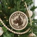 A Christmas tree decorated with ornaments, including a circular ornament with a Great Dane's head and the text "Great Dane" and "Great Dane" written around it.