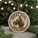 A circular ornament featuring a Great Dane dog's head, with the text "GREAT DANE" around the edge.