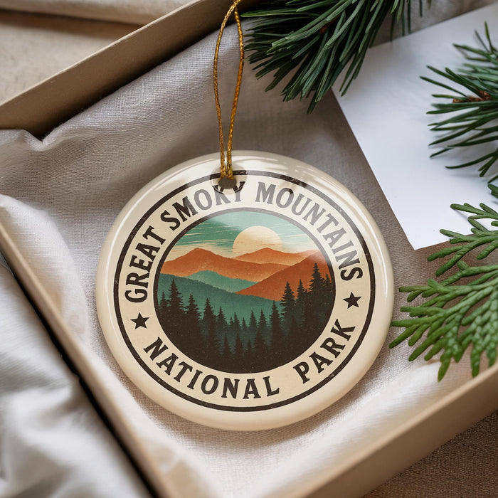 A circular ornament with the text "GREAT SMOKY MOUNTAINS NATIONAL PARK" printed on it, surrounded by pine branches.