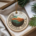 A circular ornament with the text "GREAT SMOKY MOUNTAINS NATIONAL PARK" printed on it, surrounded by pine branches.