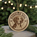 A circular ornament featuring a close-up of a dog's face, with the text "HARRIER DOG" prominently displayed.