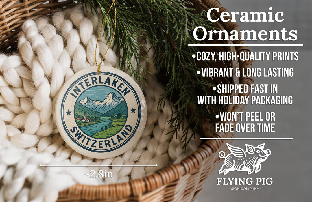 Ceramic ornaments, featuring a Swiss landscape, are displayed in a woven basket.