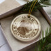 A circular ornament with the text "IRISH WOLFHOUDUND" and an illustration of a wolfhound dog.
