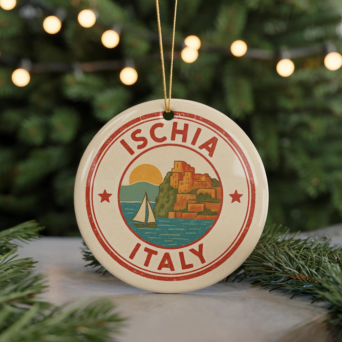 A circular ornament with the text "ISCHIA ITALY" and an illustration of a sailboat on the water, surrounded by a scenic landscape.