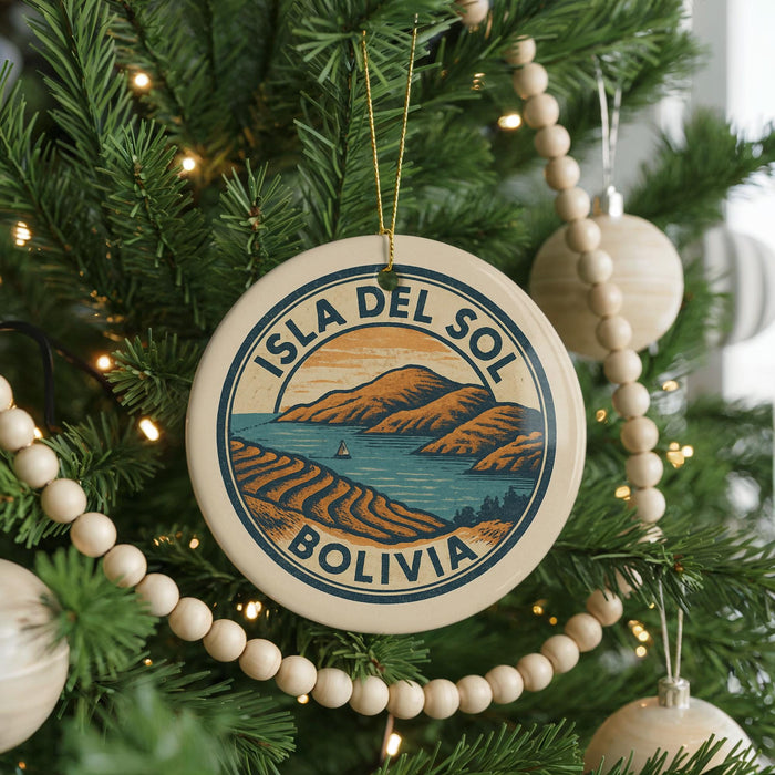 A round ornament on a Christmas tree, featuring a scenic image of the island of Bolivia.