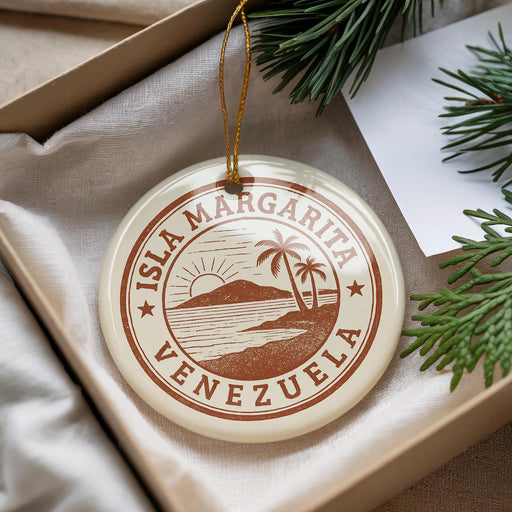A circular ornament with the text "ISLA MARGARITA VENEZUELA" printed on it, surrounded by a decorative string and pine branches.