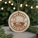 A circular ornament with the text "ISLAMABAD PAKISTAN" printed on it, surrounded by a decorative border and a star symbol.