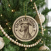 A Christmas tree decorated with ornaments, including a circular ornament with an illustration of an Italian Greyhound dog and the text "ITALIAN GREYHOUND".