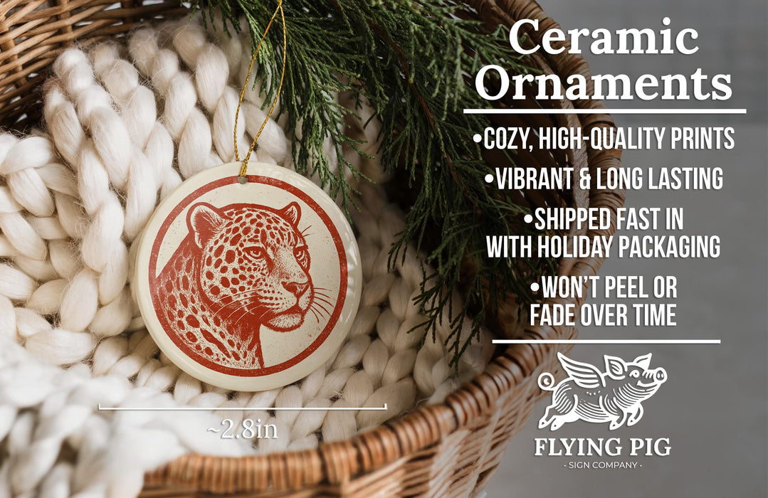 Ceramic ornaments, featuring a leopard print design, are displayed in a wicker basket.