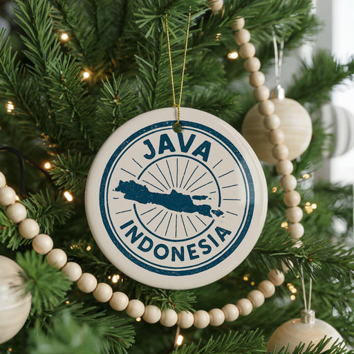 A Christmas tree decorated with ornaments, including a circular ornament with the text "JAMA" and "INDONESIA" printed on it.