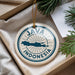 A circular ornament with the text "JAMA INDONESIA" printed on it, hanging from a string.